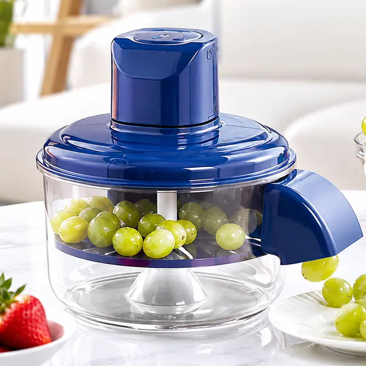 PeelPro, preparador eléctrico con recipiente transparente lleno de uvas